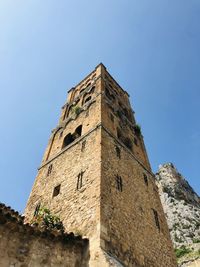 Low angle view of old ruins against clear sky