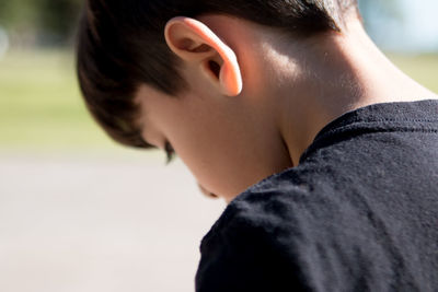 Close-up portrait of young boy thinking