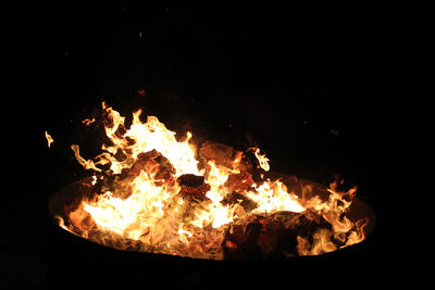 Close-up of bonfire against sky at night