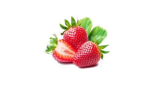 Close-up of strawberry over white background