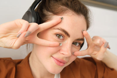 Close-up of young woman looking away