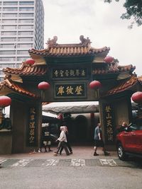 Group of people in temple against building