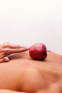 Close-up of hand holding apple