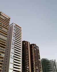 Low angle view of modern buildings against sky