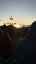 Scenic view of land against sky during sunset