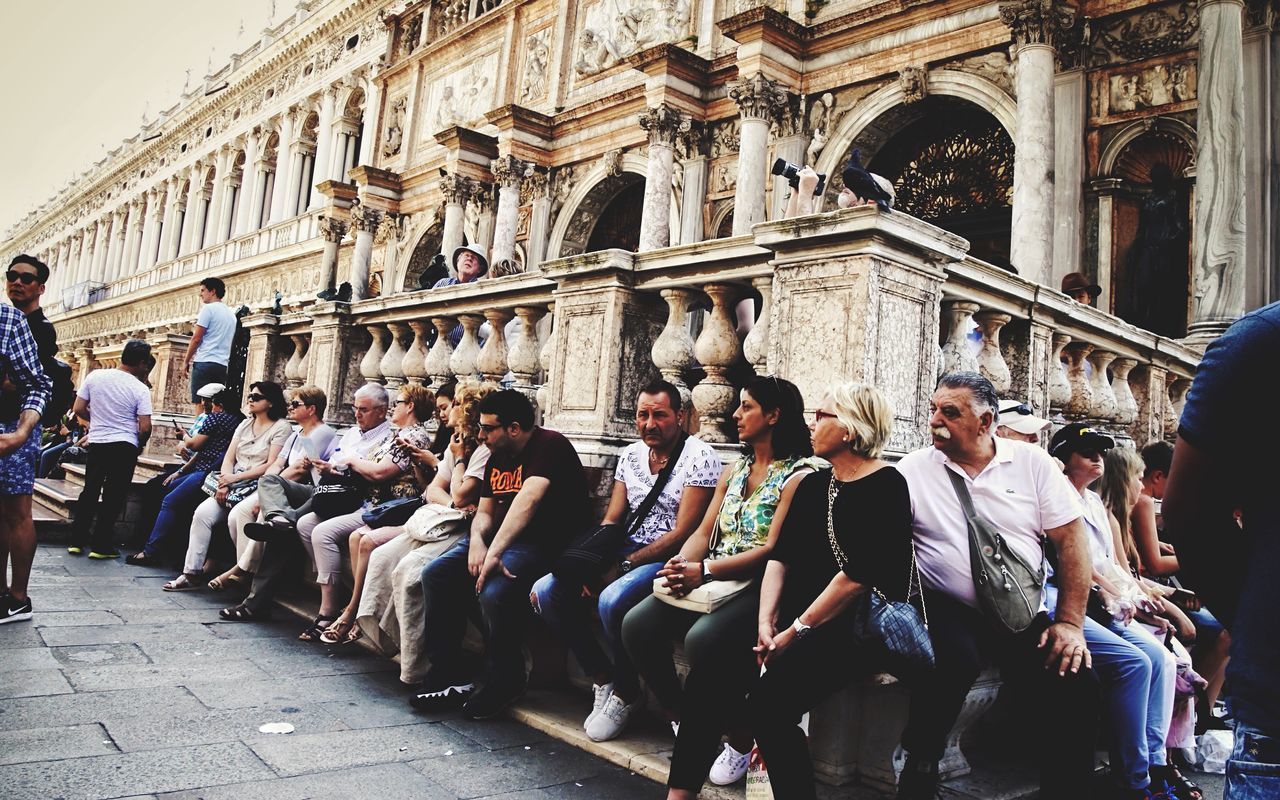 large group of people, real people, architecture, men, built structure, day, sitting, building exterior, lifestyles, togetherness, outdoors, women, crowd, people