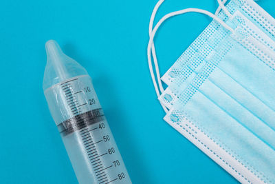 High angle view of blue paper against white background