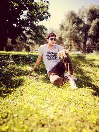 Young man wearing sunglasses on field