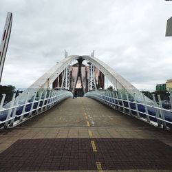 View of bridge against cloudy sky