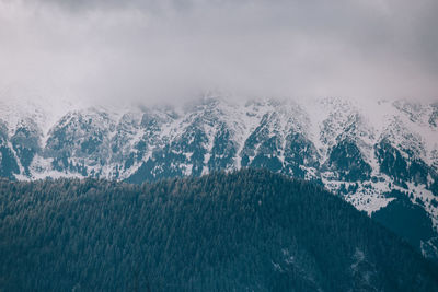Scenic view of mountains against sky during winter