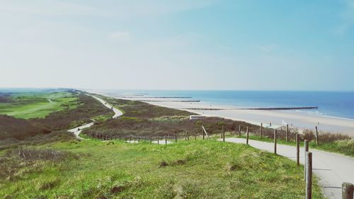 View of beach against blue sky