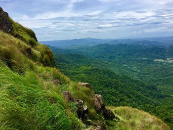 Scenic view of mountains against blue sky