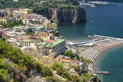 High angle view of townscape by sea