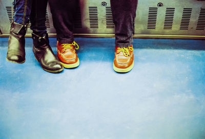 Low section of men standing on floor