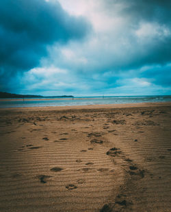 Scenic view of sea against cloudy sky