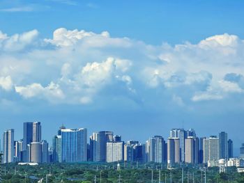 Modern buildings in city against sky