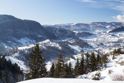 Scenic view of snowcapped mountains against sky