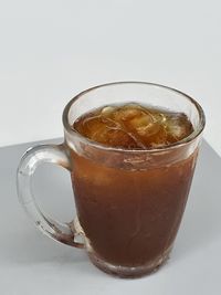 Close-up of coffee cup against white background