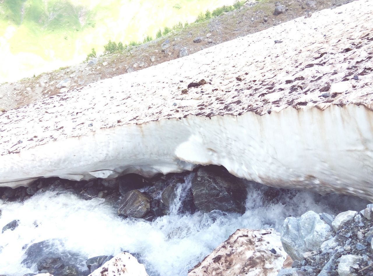 water, motion, rock - object, wave, splashing, flowing water, nature, beauty in nature, power in nature, scenics, day, outdoors, rock formation, flowing, no people, rock, idyllic, tranquility, non-urban scene, tranquil scene, travel destinations, sky, remote, non urban scene