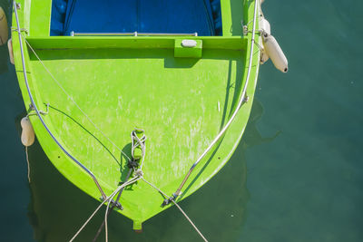 High angle view of green boat in sea at harbor