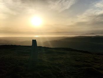 Scenic view of landscape against sky during sunset
