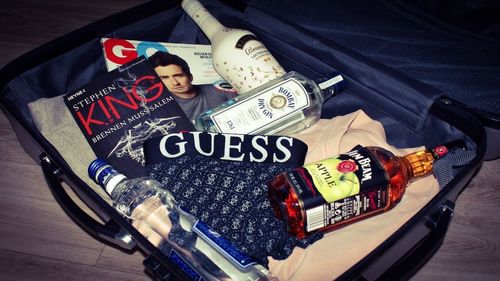 High angle portrait of boy lying on bed