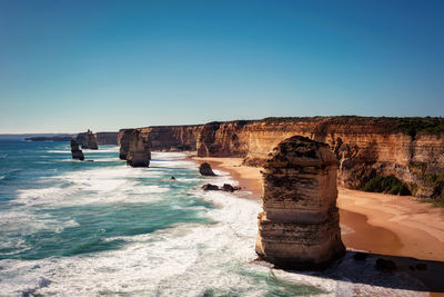 Scenic view of sea against clear blue sky