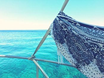 Close-up of ship against sea