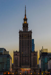 Low angle view of buildings against sky during sunset
