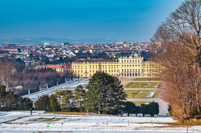 Scenic view of city against clear sky during winter