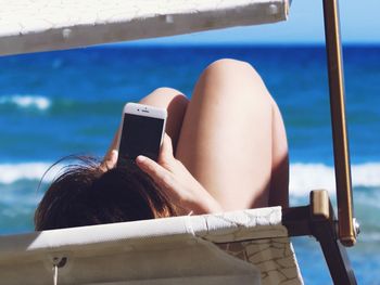 Woman photographing with mobile phone