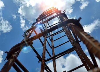Low angle view of rollercoaster against sky