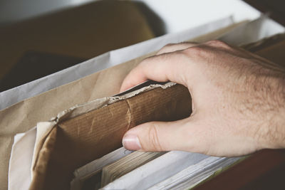 Close-up of hand holding paper