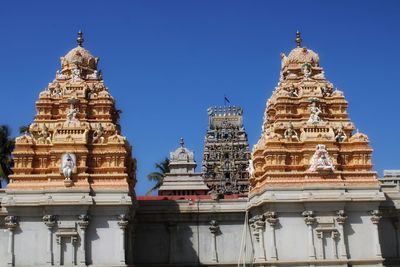 Low angle view of temple building against clear sky