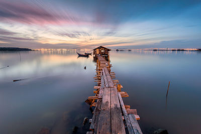 Scenic view of lake against sky during sunset