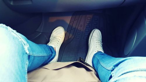 Low section of man wearing canvas shoes