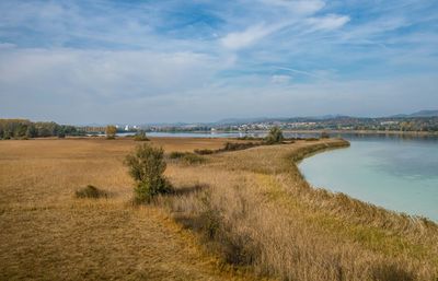 Scenic view of landscape against cloudy sky