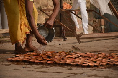 Low section of men working on wood