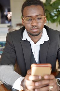 Portrait of man using mobile phone