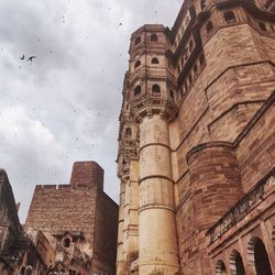Low angle view of historic building against sky