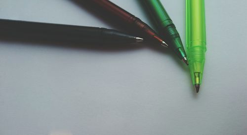 Close-up of ballpoint pens on table