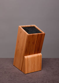 Close-up of wooden table against white background