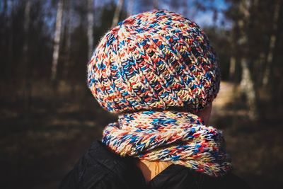 Close-up of woman wearing knit hat and scarf