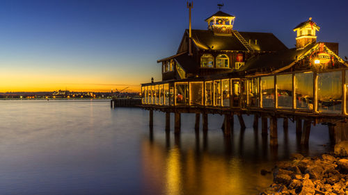 View of illuminated building at sunset