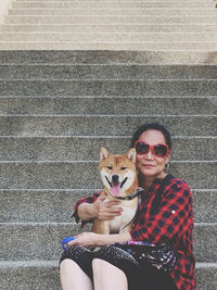 Portrait of woman with dog