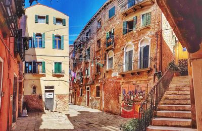 Narrow street amidst buildings in town