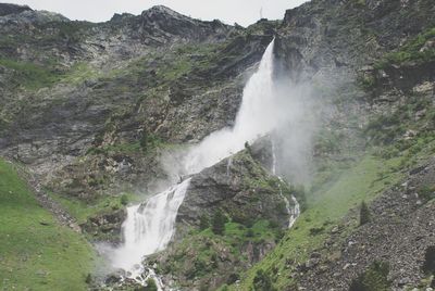 Low angle view of serio falls on mountain