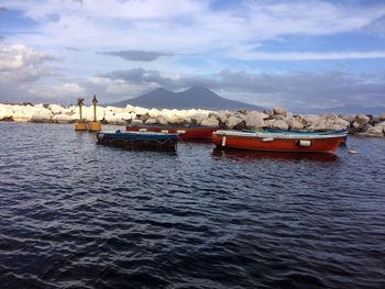 Fishing boats in sea against sky, vesubio italy