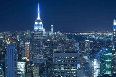 Illuminated buildings in city at night