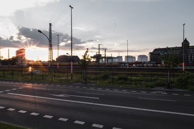 Road against cloudy sky at sunset